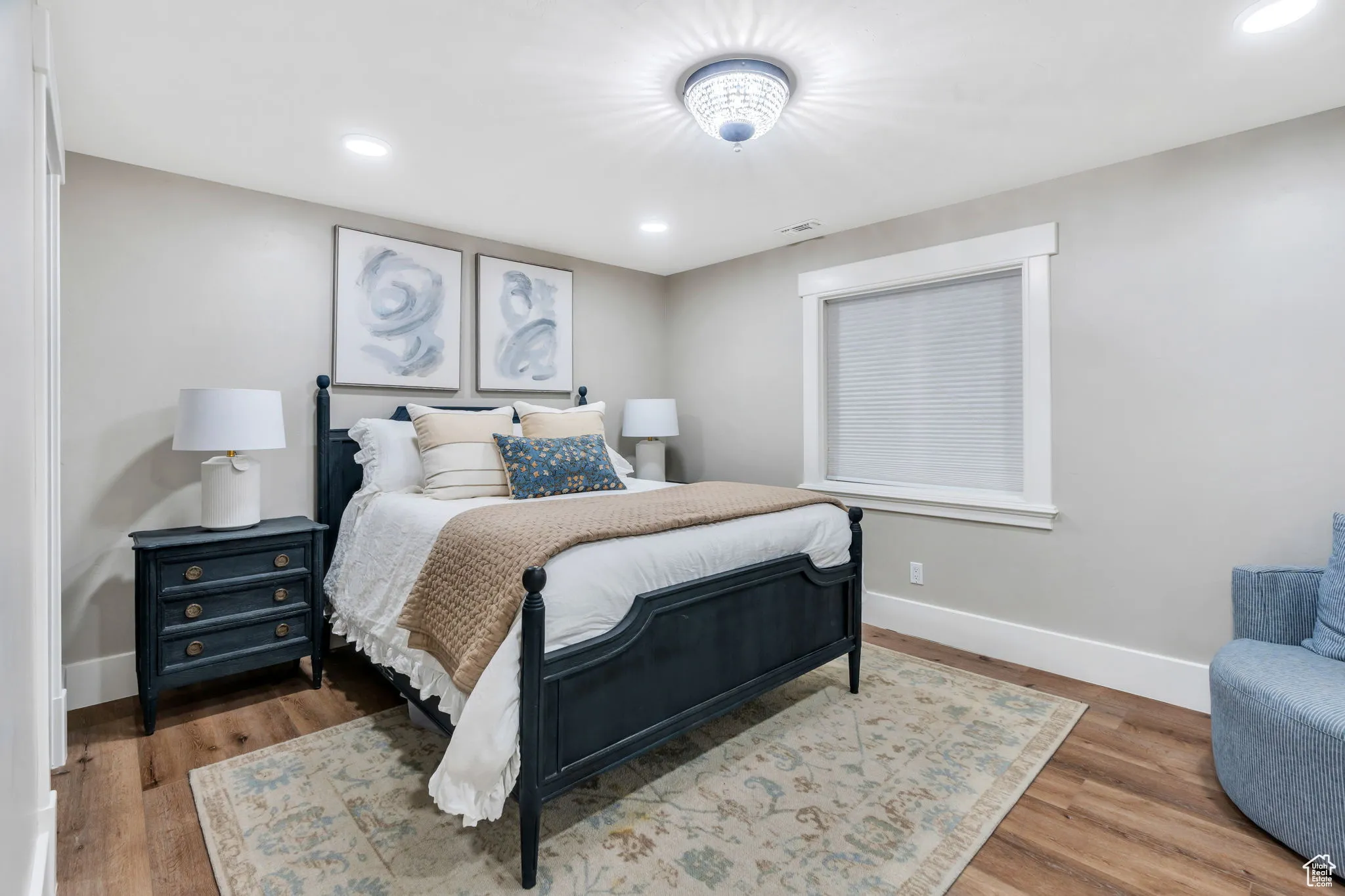 Bedroom with wood finished floors and recessed lighting