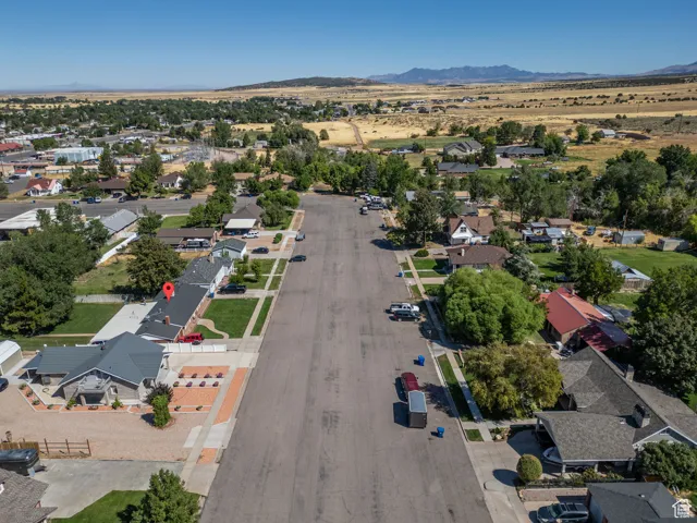 Aerial view of residential area featuring a mountain backdrop