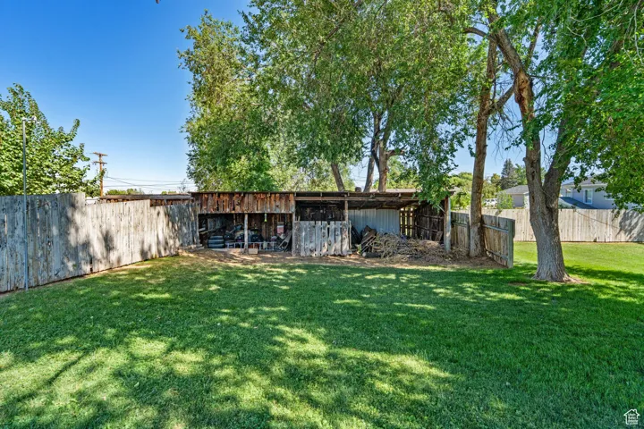 View of yard with an outbuilding and a patio area