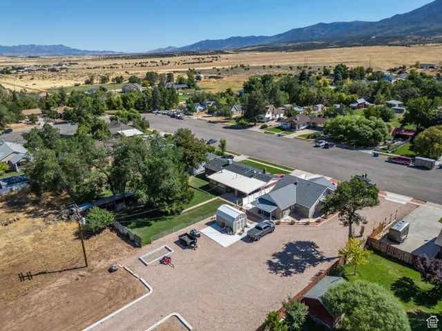 Aerial perspective of suburban area featuring a mountain backdrop