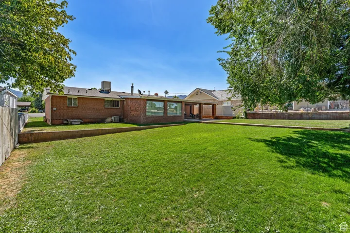 Back of property with brick siding