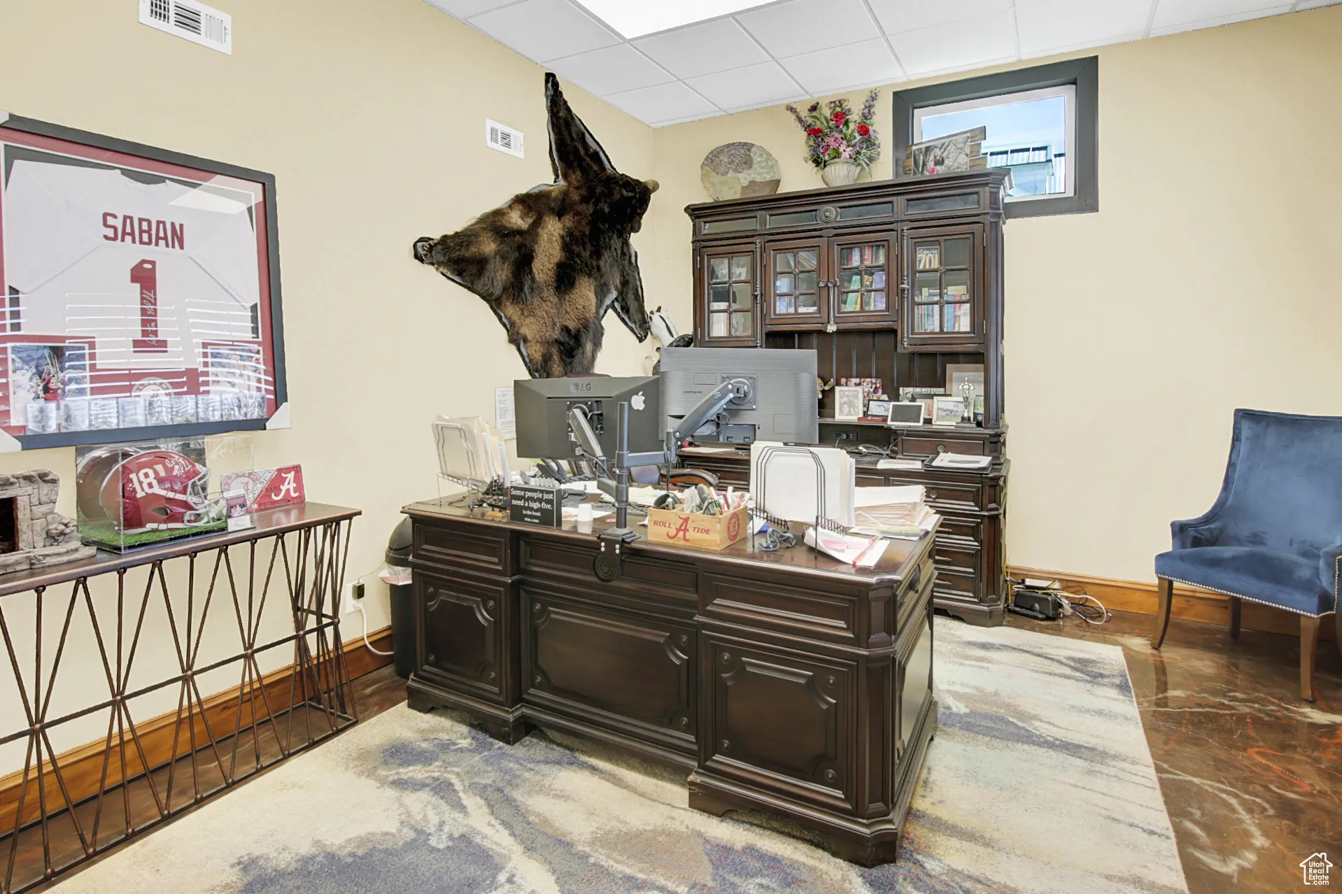 Home office with a paneled ceiling and baseboards