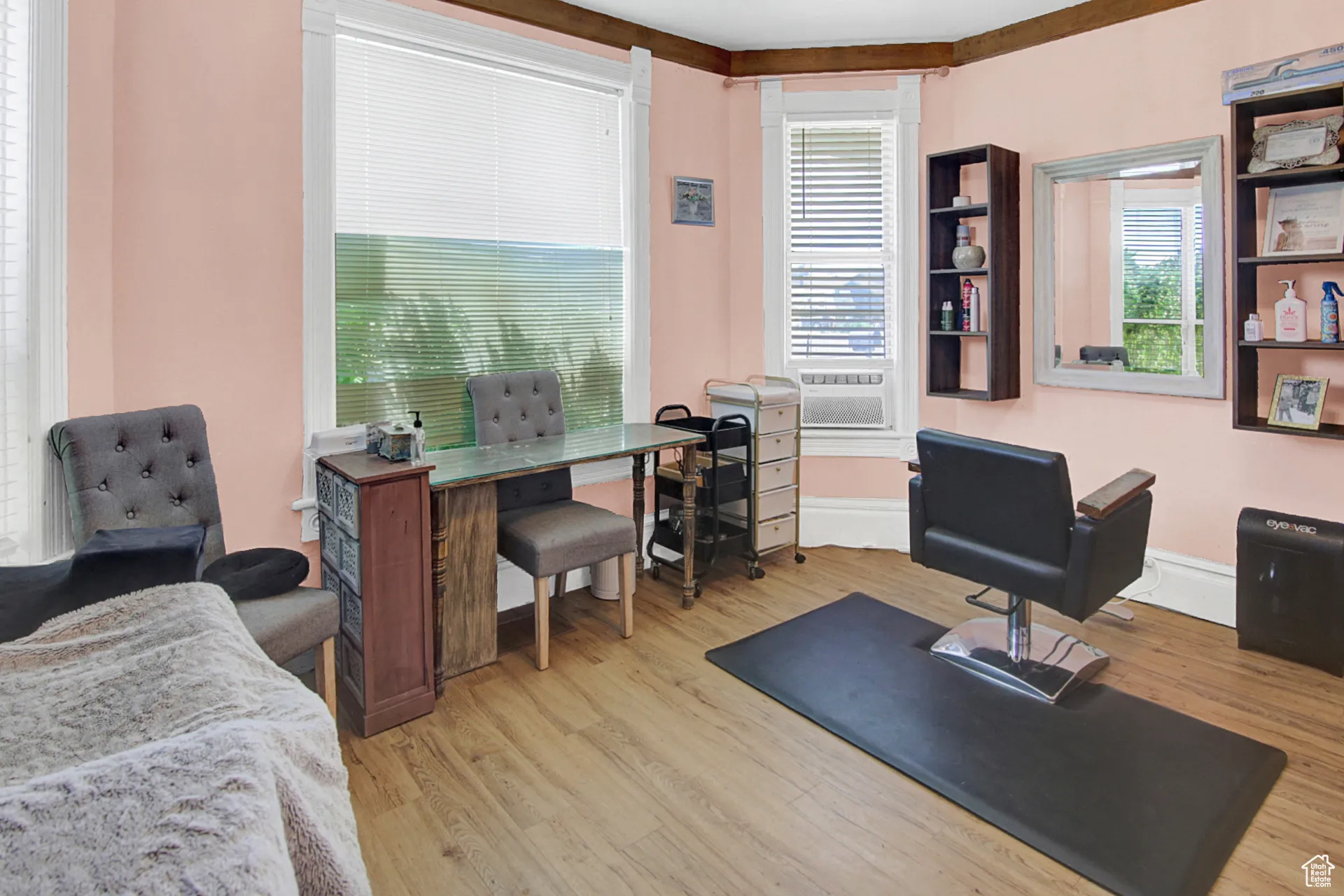 Office space with light wood finished floors and baseboards