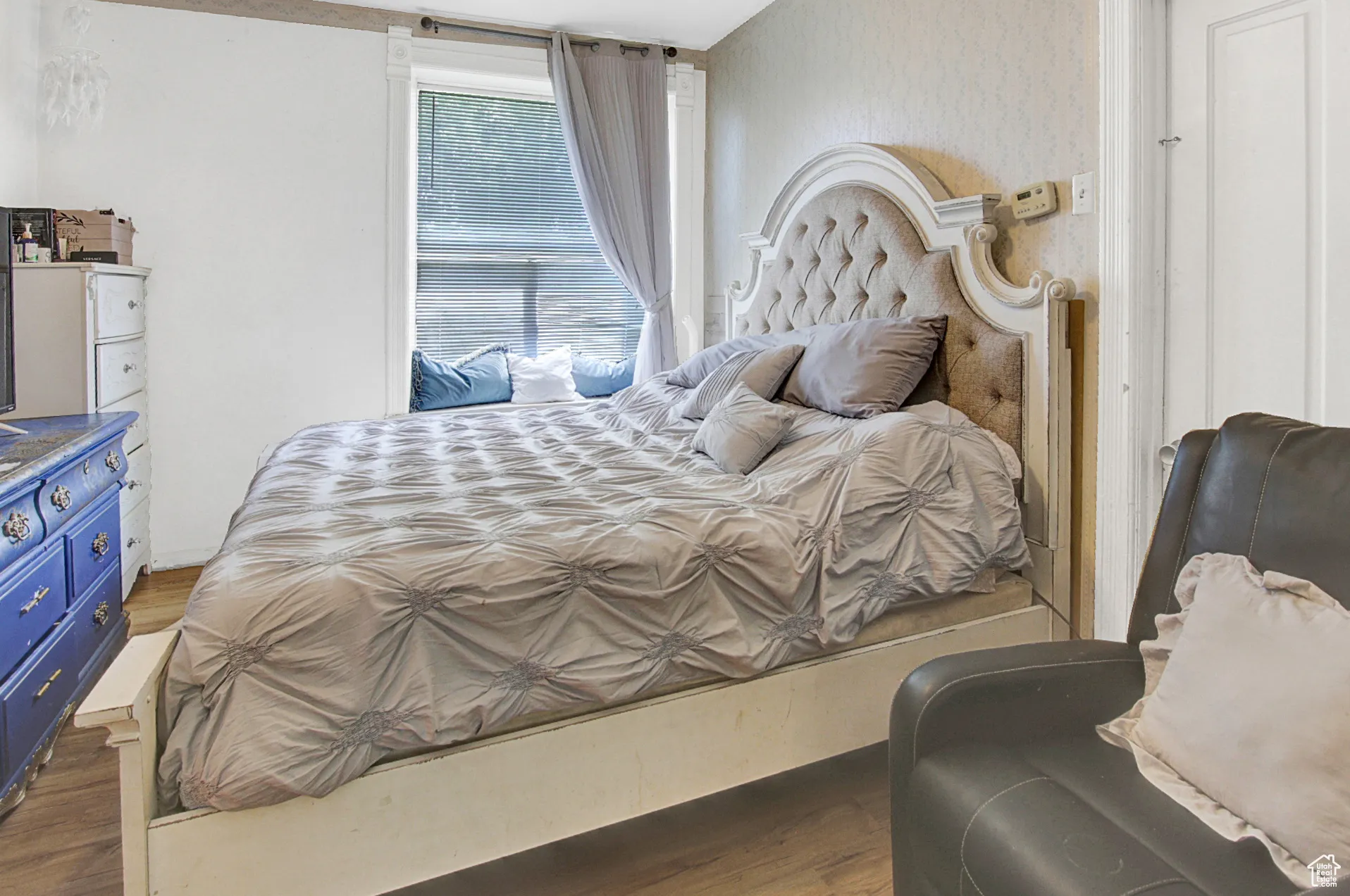 Bedroom with dark wood-style floors