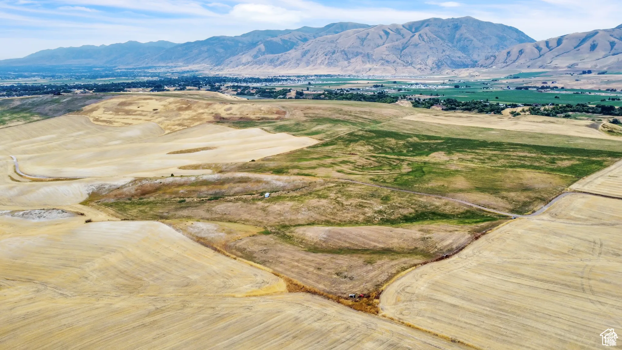 View of mountain background featuring rural landscape