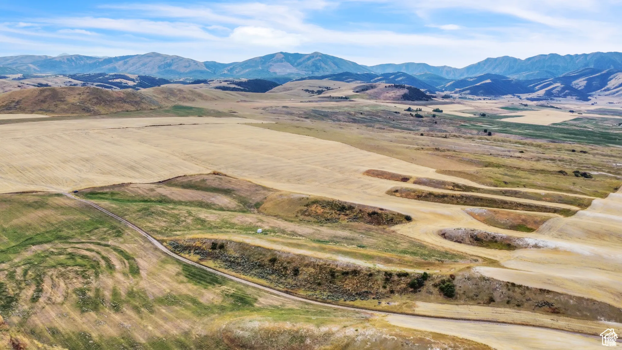 View of mountain background featuring rural landscape