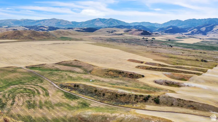 View of mountain background featuring rural landscape