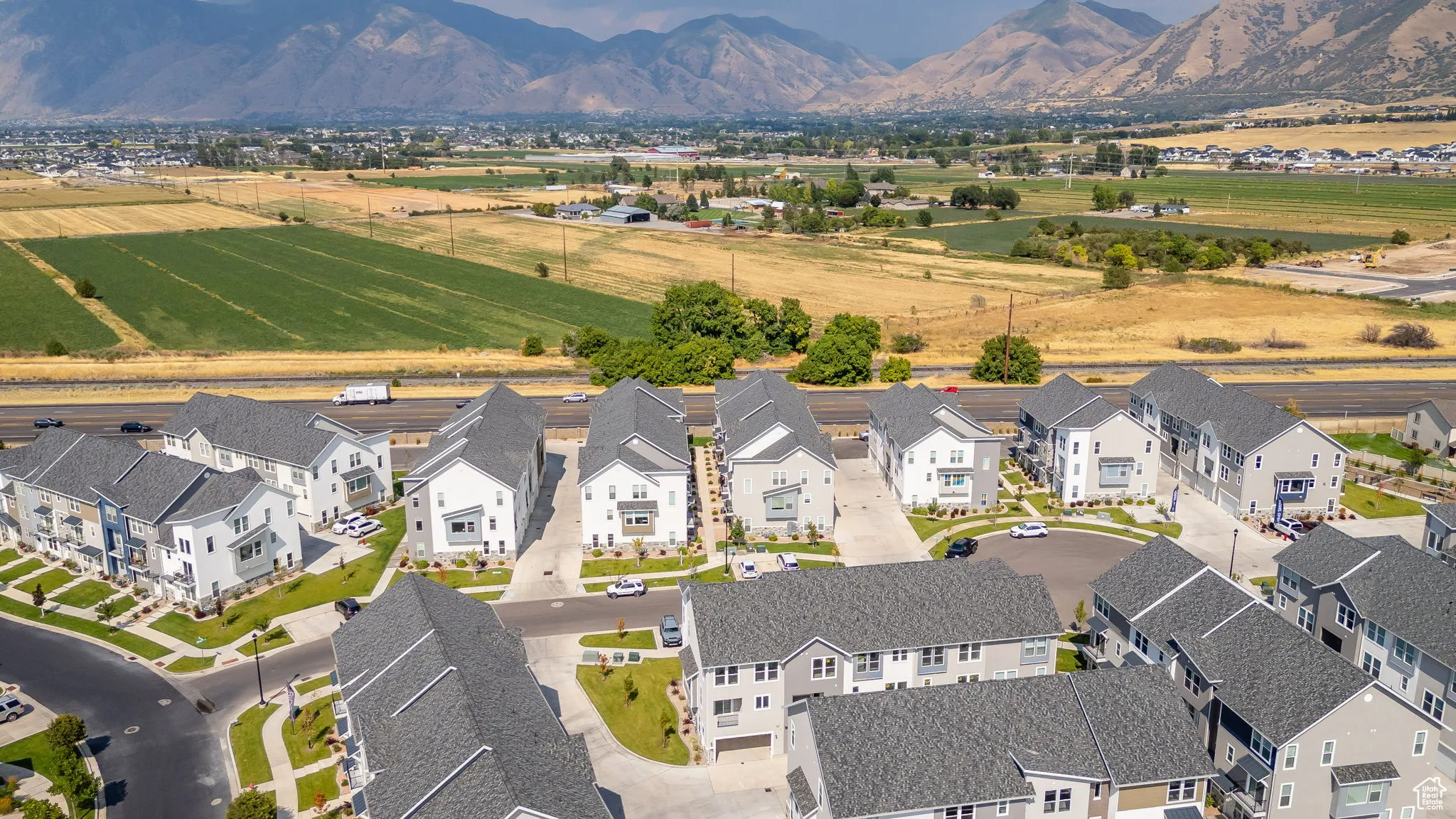 Aerial view of residential area featuring a mountainous background