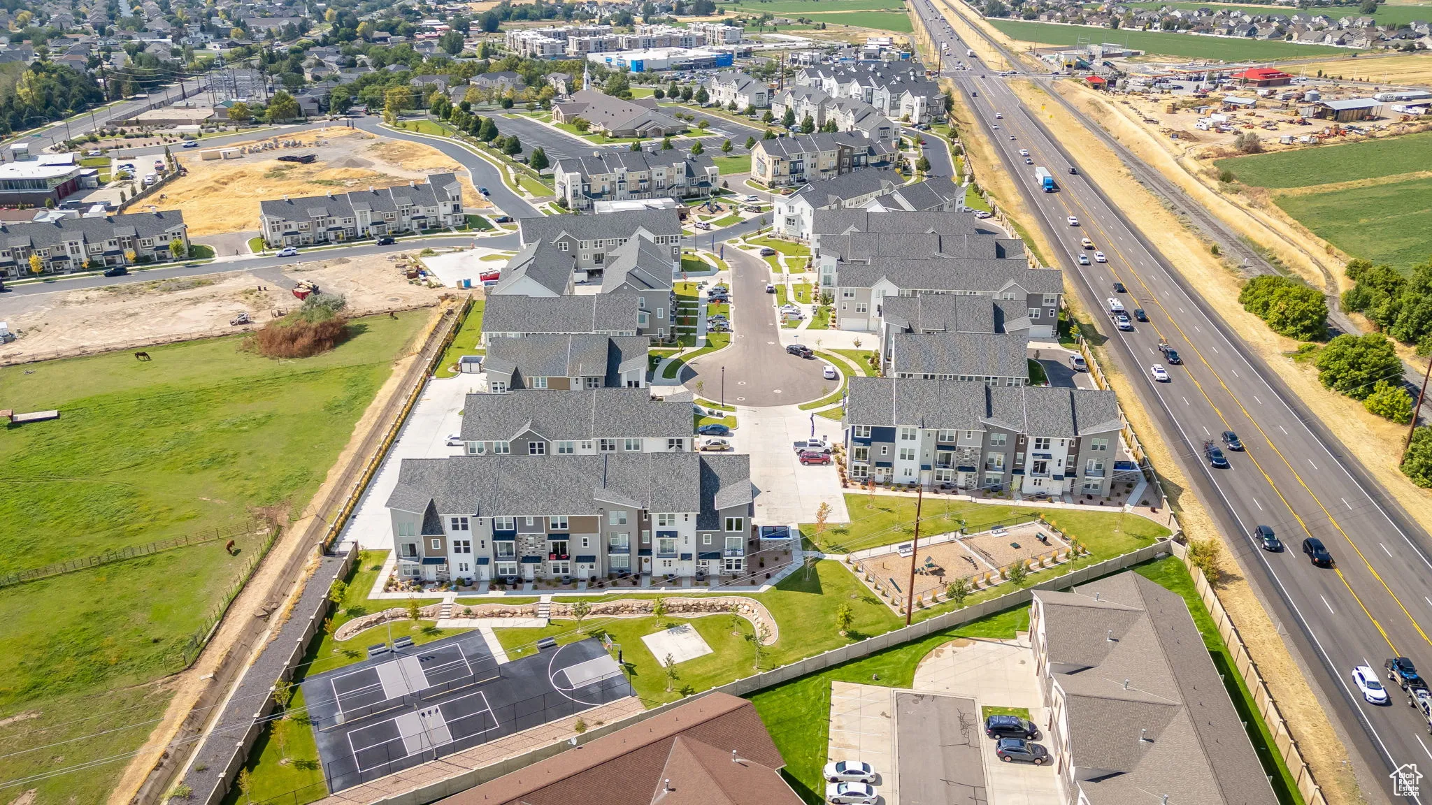 View of property location with nearby suburban area