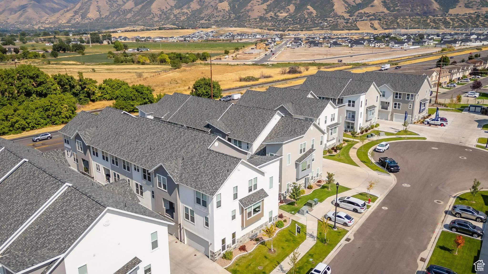 Aerial perspective of suburban area with a mountain backdrop