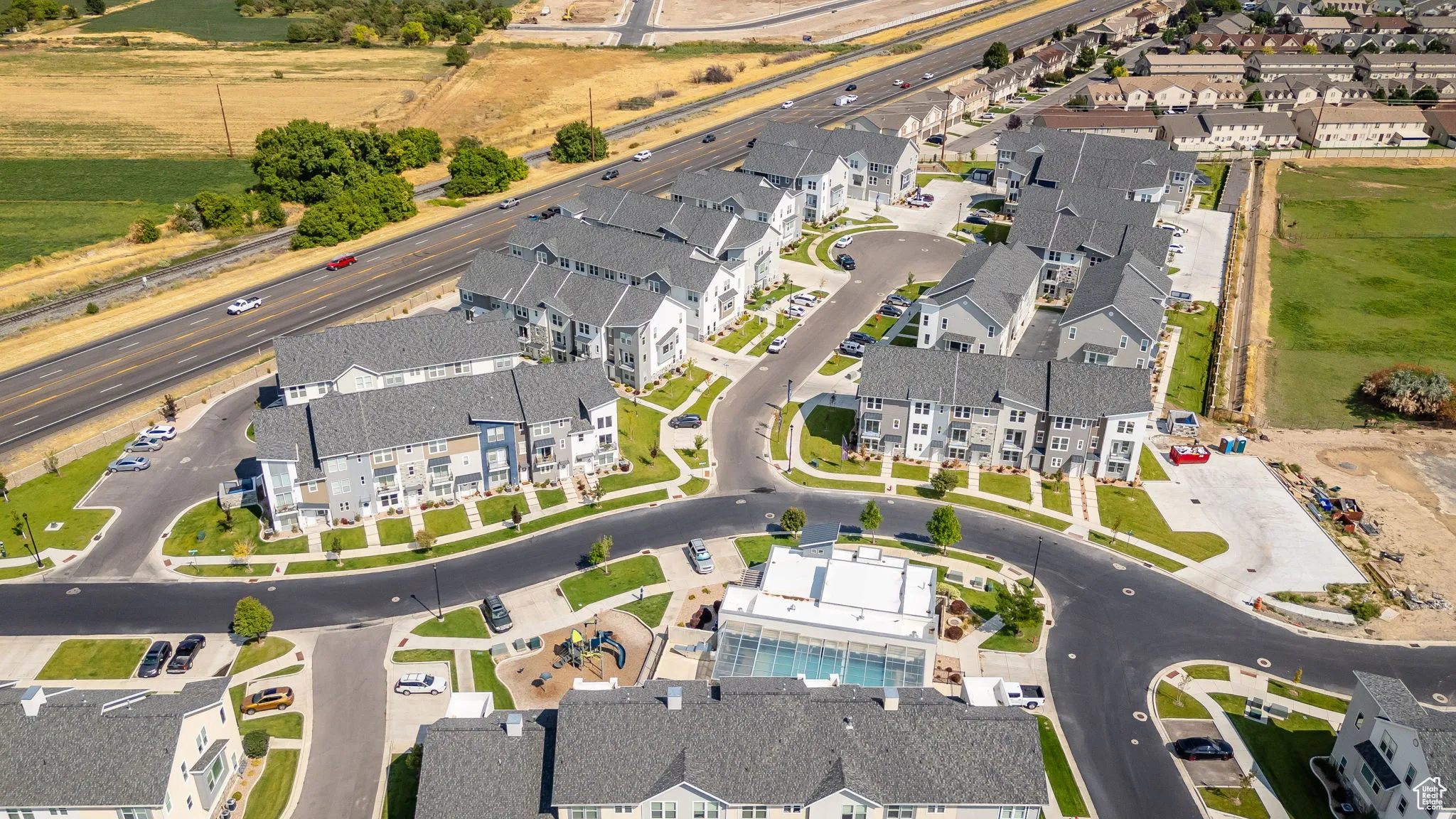 Aerial view of property's location featuring nearby suburban area