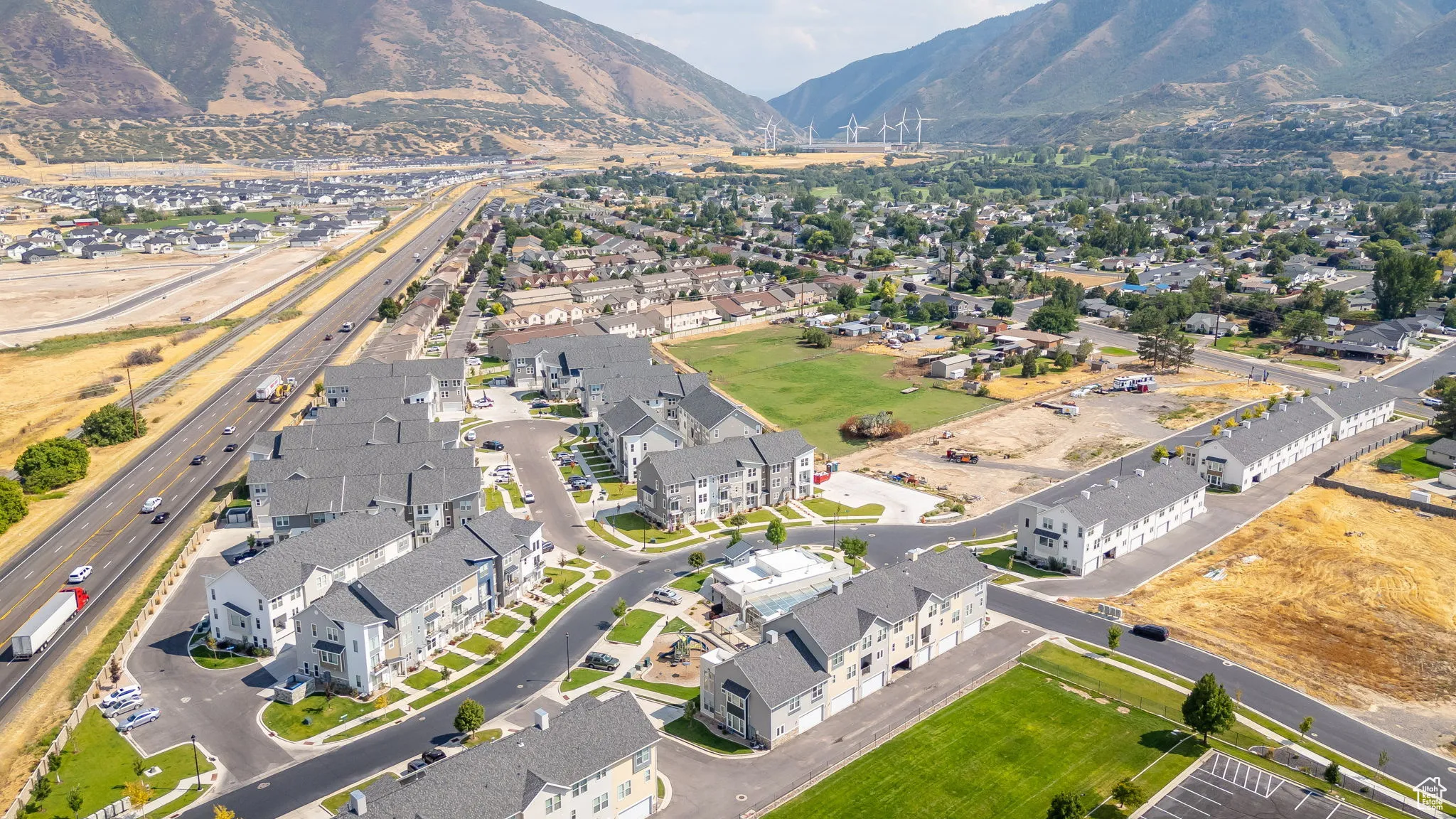 View of property location with nearby suburban area and mountains