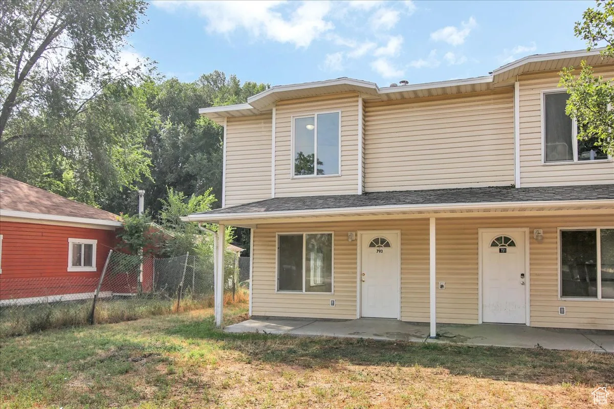 View of front facade featuring roof with shingles