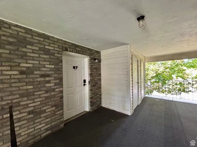Property entrance with brick siding