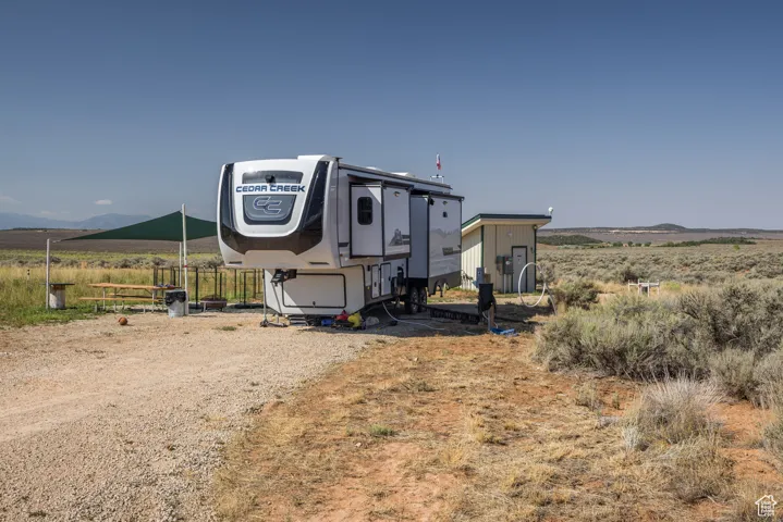 View of campsite with well house in the back.
