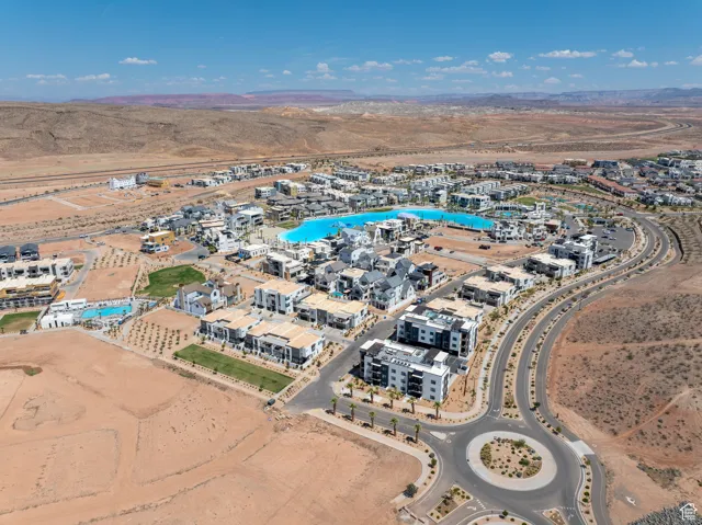 Aerial overview of property's location featuring a desert landscape and a mountainous background