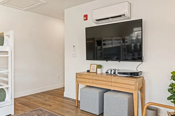 Detailed view of a wall unit AC and wood finished floors