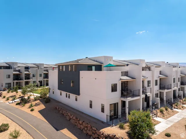 View of property with a residential view