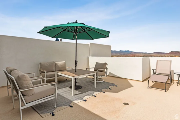 View of patio / terrace featuring outdoor lounge area and a mountain view