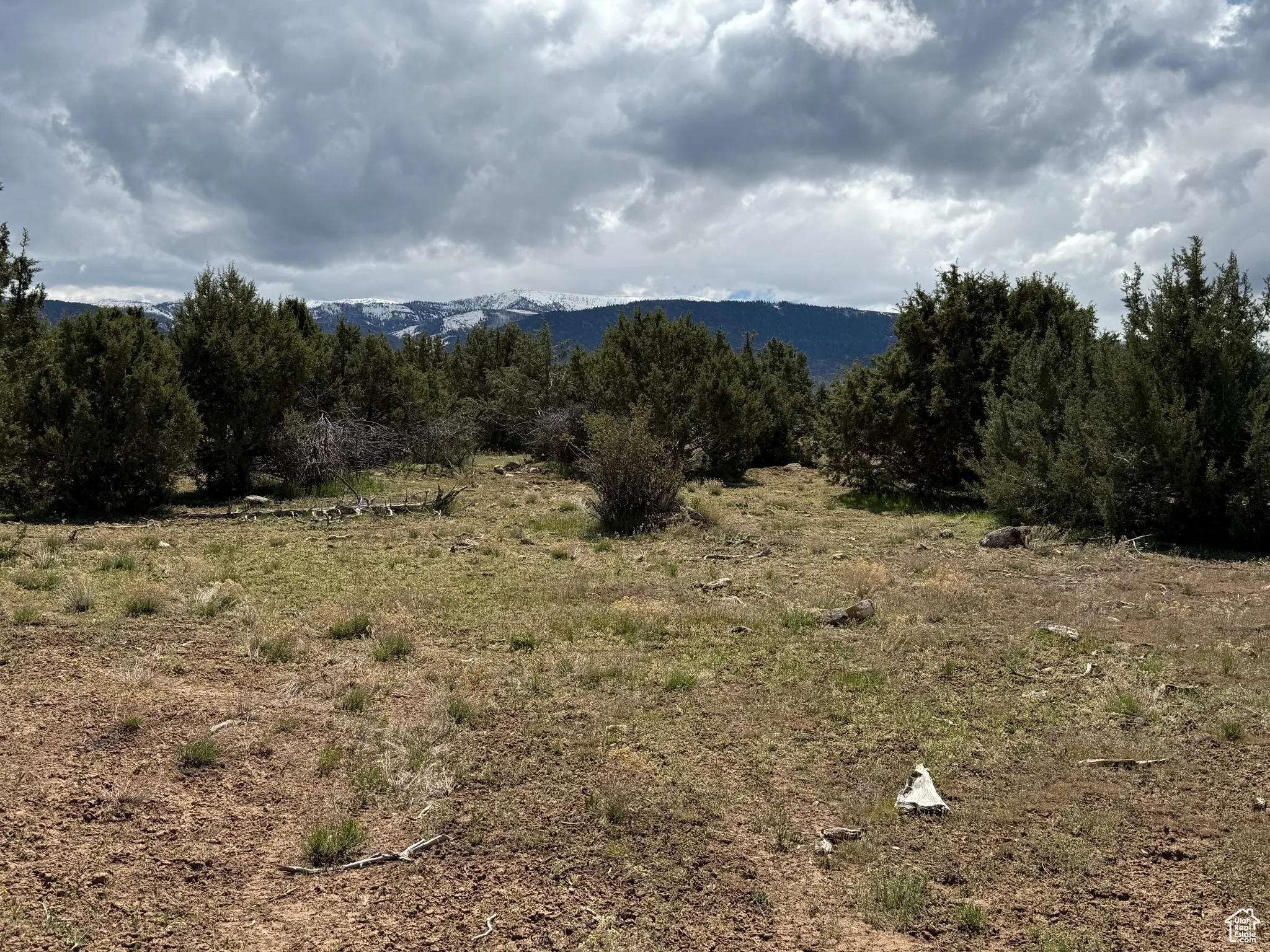 View of mountain backdrop with rural landscape
