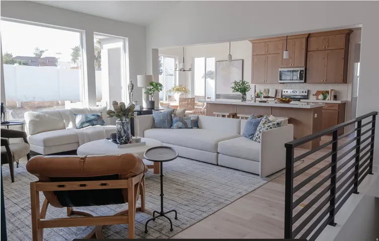 Living room with light wood finished floors and lofted ceiling