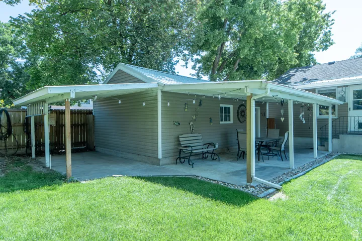 Back of property featuring a patio area and a metal roof