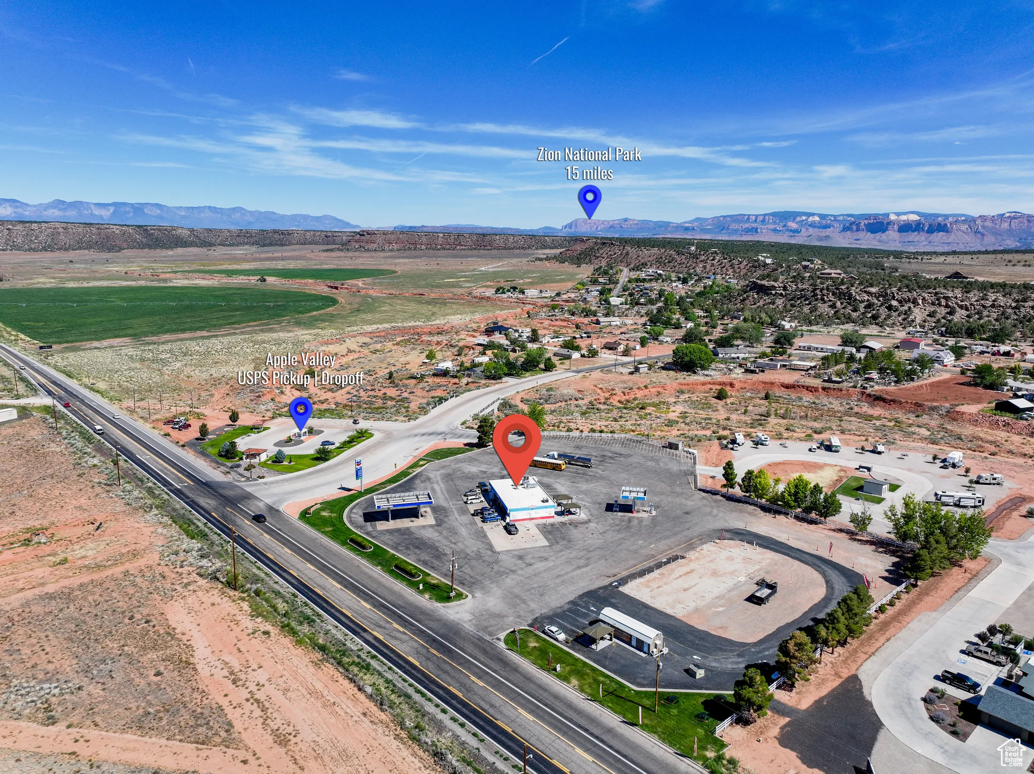 Aerial view of property and surrounding area with mountains