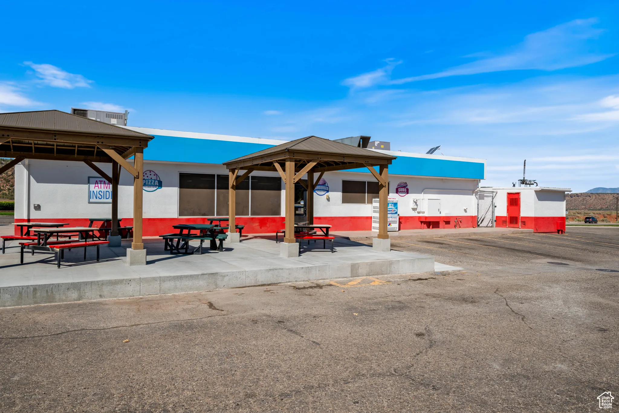 View of property's community with a gazebo and a patio