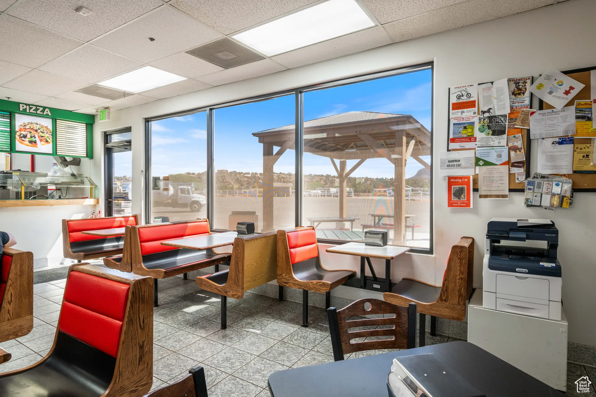 Common area with a drop ceiling and a water view