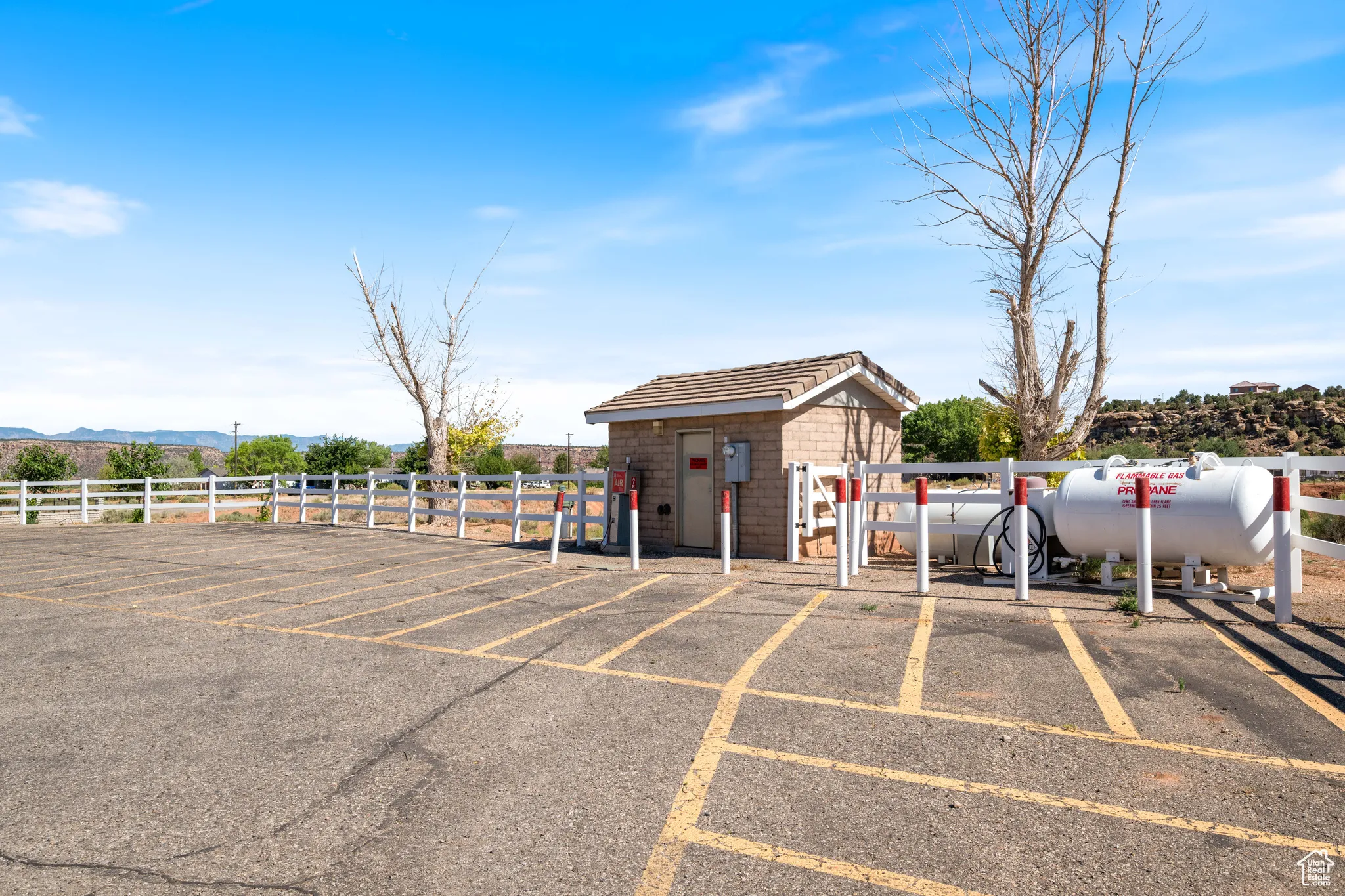 Uncovered parking lot featuring a mountain view