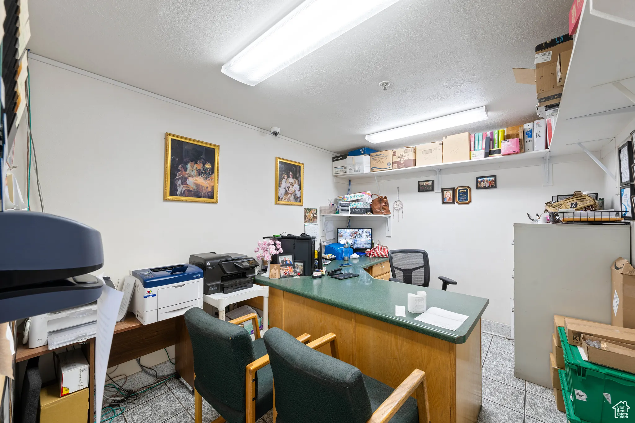 Home office with a textured ceiling and light tile patterned floors
