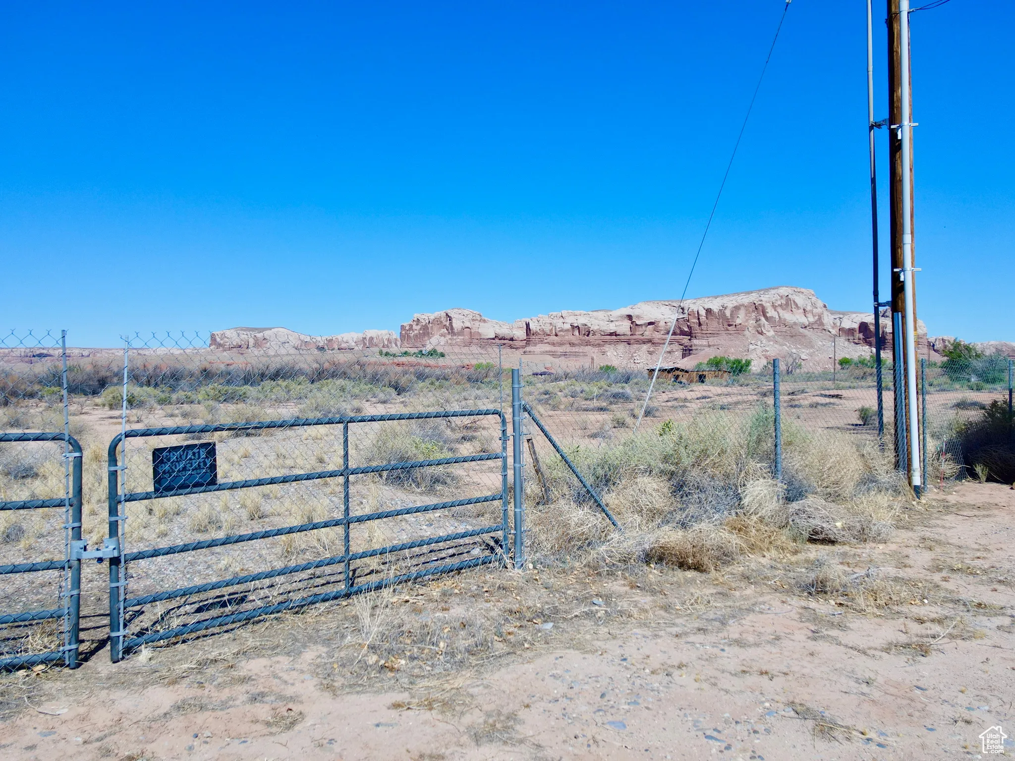 Gate featuring a mountain view and a view of countryside