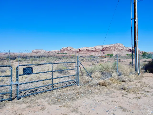 Gate featuring a mountain view and a view of countryside