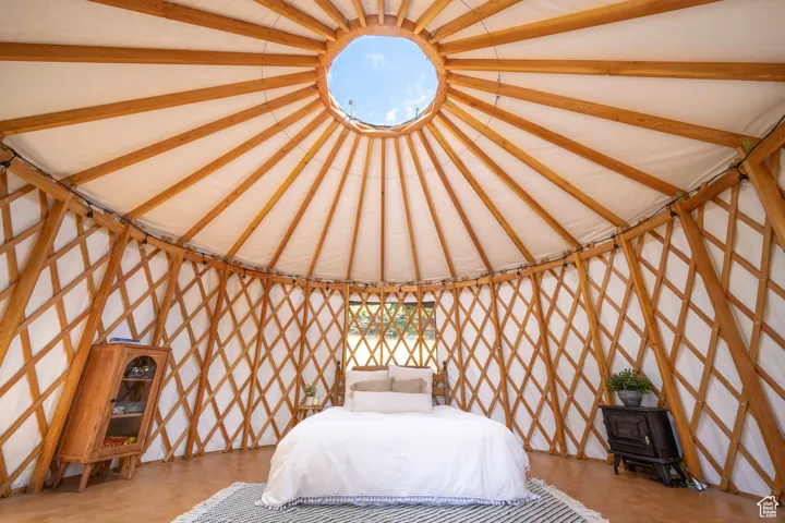 Unfurnished bedroom with vaulted ceiling