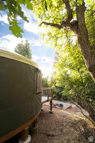View of yard with a wooden deck