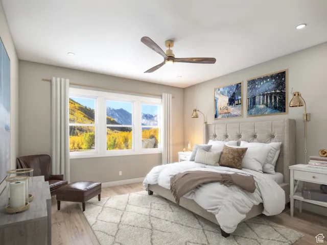 Bedroom with light wood finished floors, a ceiling fan, and recessed lighting