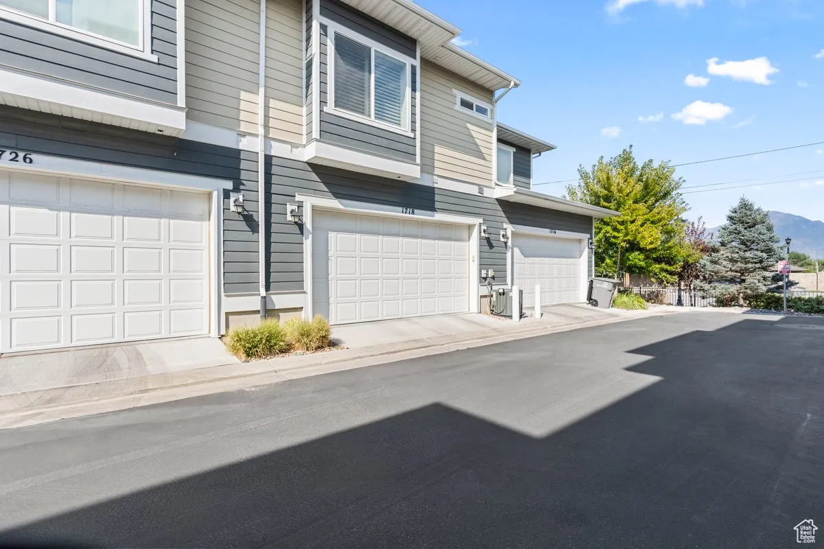 View of front facade featuring an attached garage and a mountain view