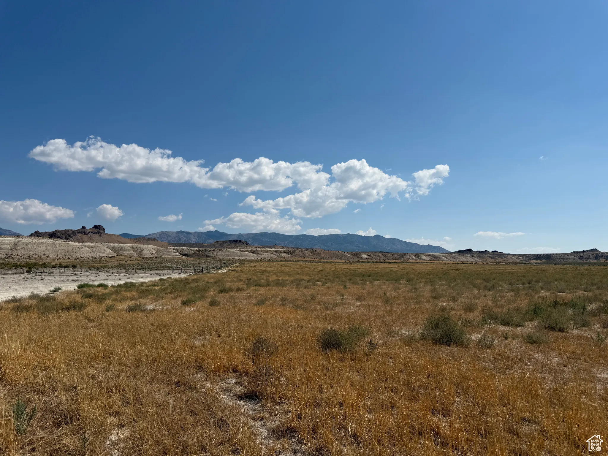 View of mountain backdrop featuring rural landscape