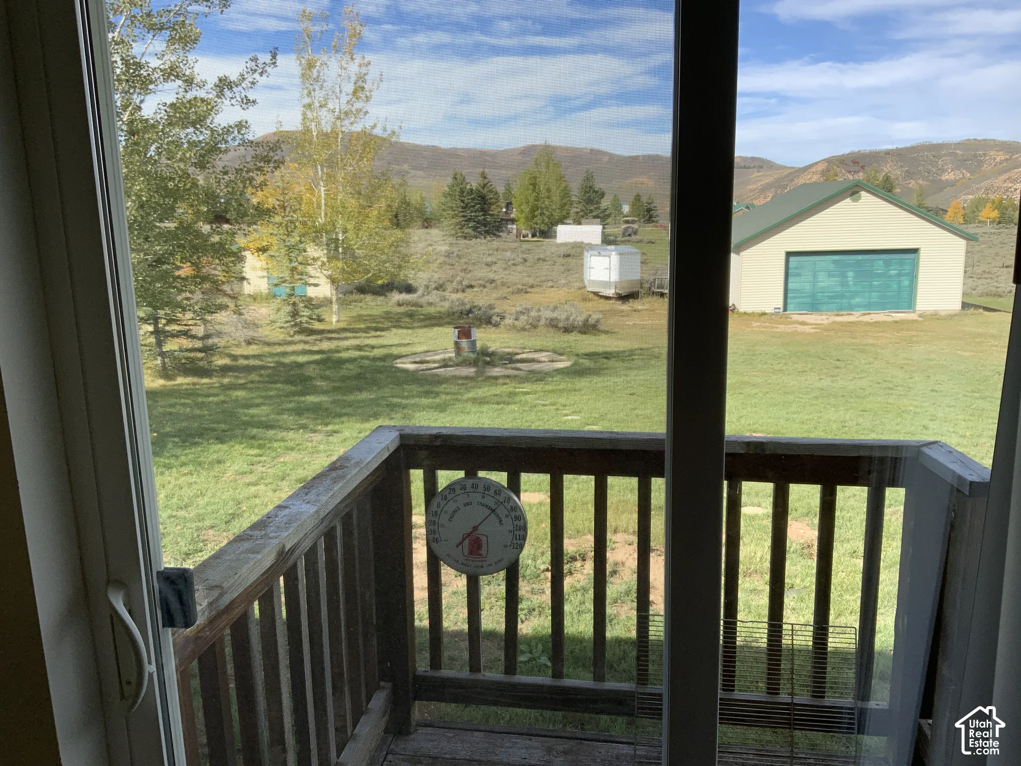 Sliding glass door opening to a wooden deck
