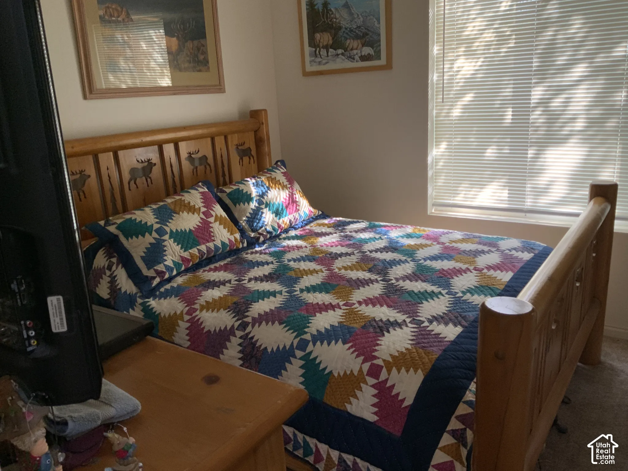 Wood-finish bed frame with carved details
