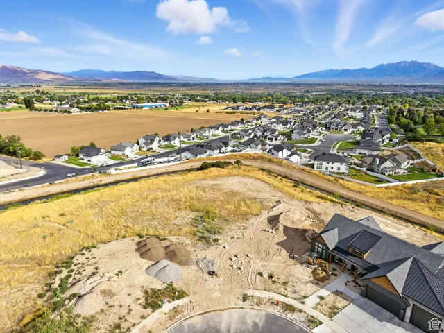 Aerial view of residential area featuring a mountainous background
