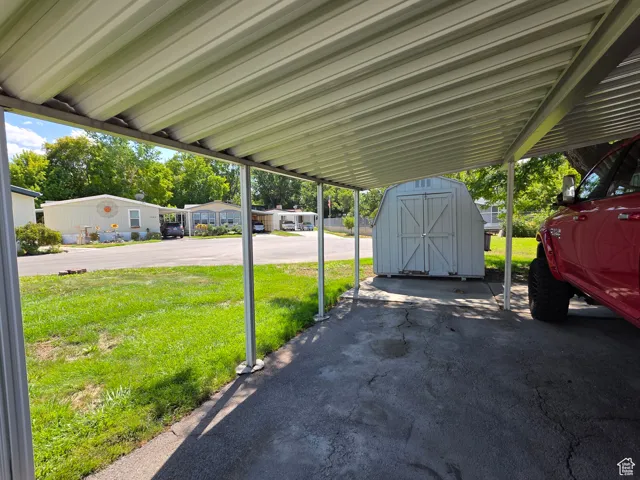 View of patio / terrace featuring a storage unit