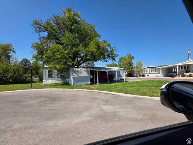 View of front of property with a front lawn