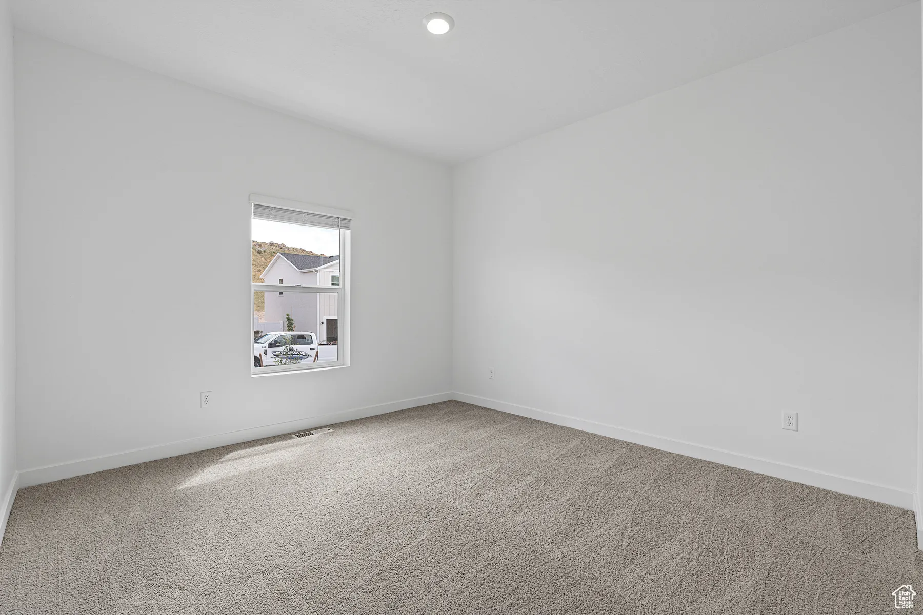 Unfurnished room featuring light colored carpet and recessed lighting
