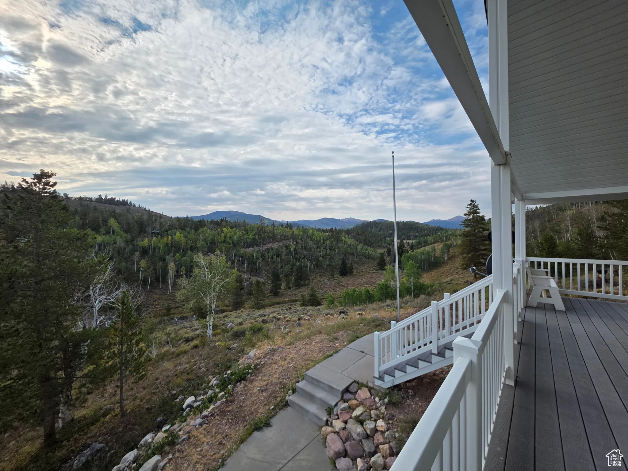 Wooden terrace featuring a mountain view