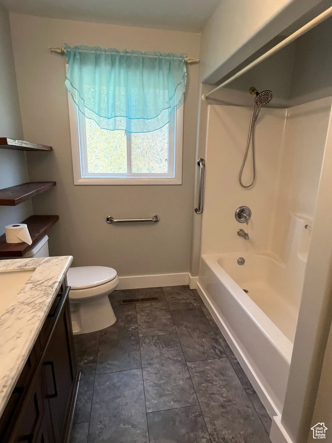 Full bath featuring shower / washtub combination and vanity