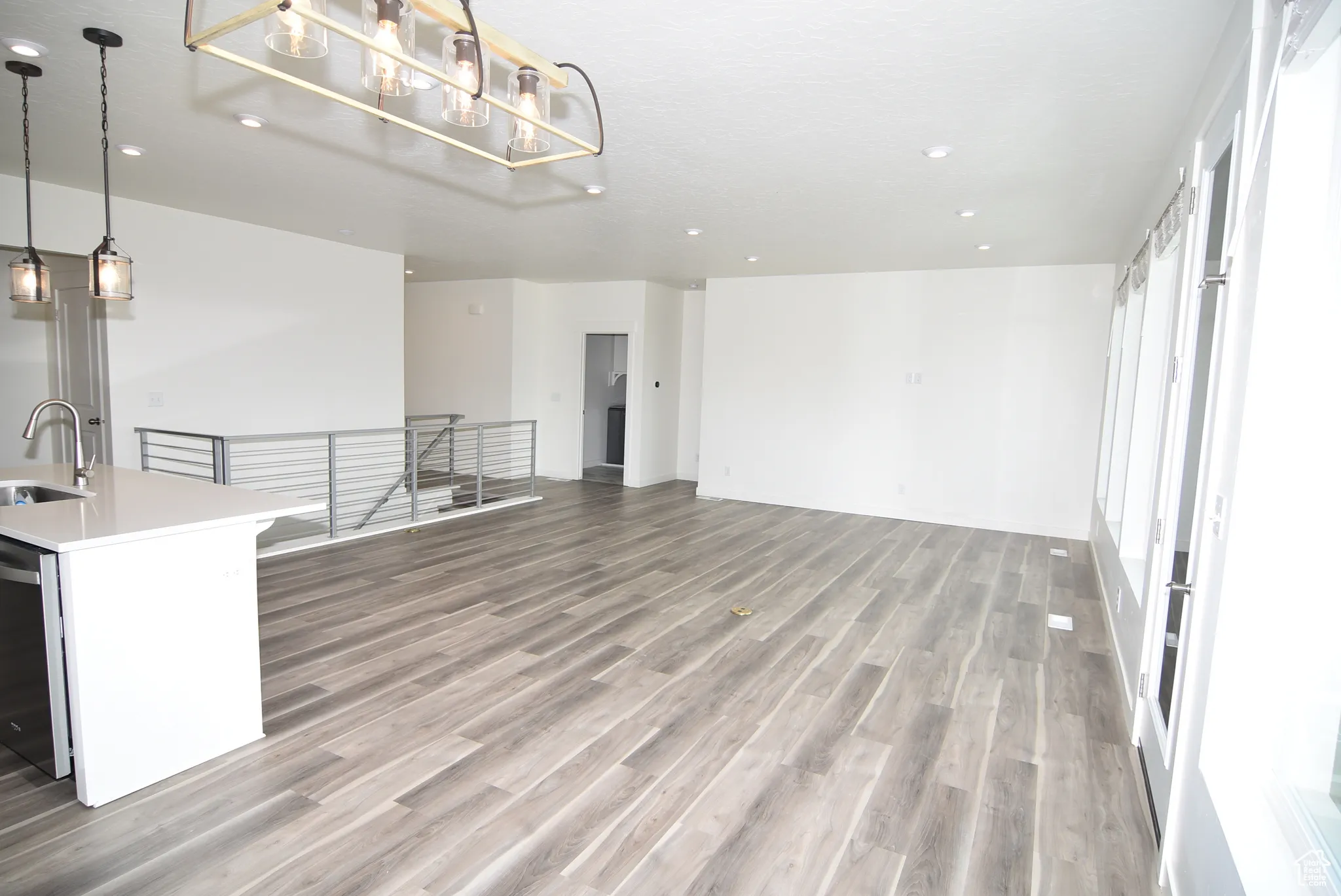 View of access to Owner's suite, laundry and front entry way.