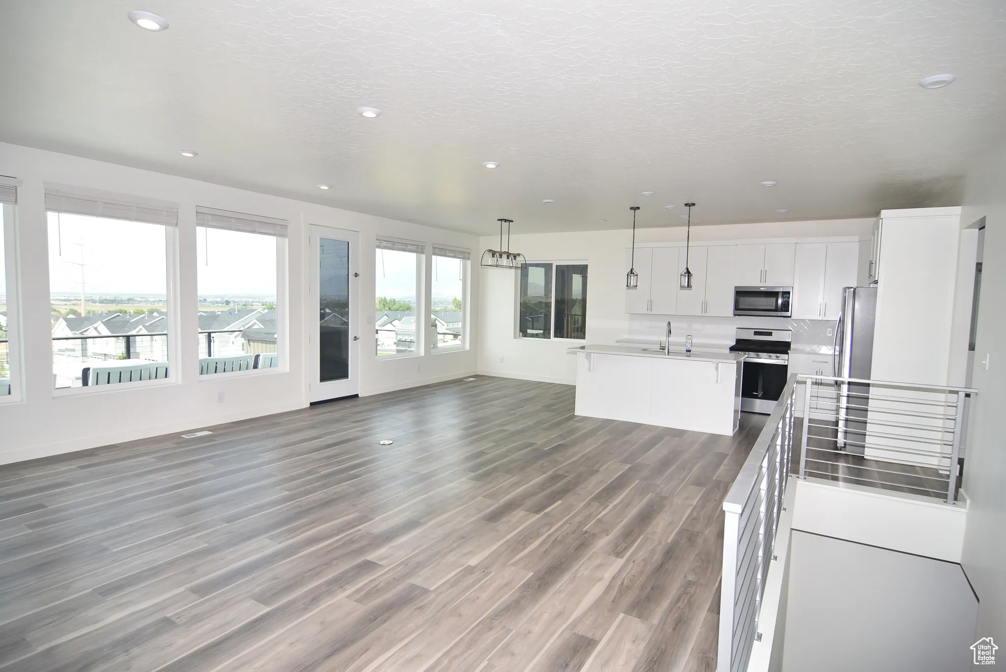 Open floor plan featuring great room, kitchen and dining area.