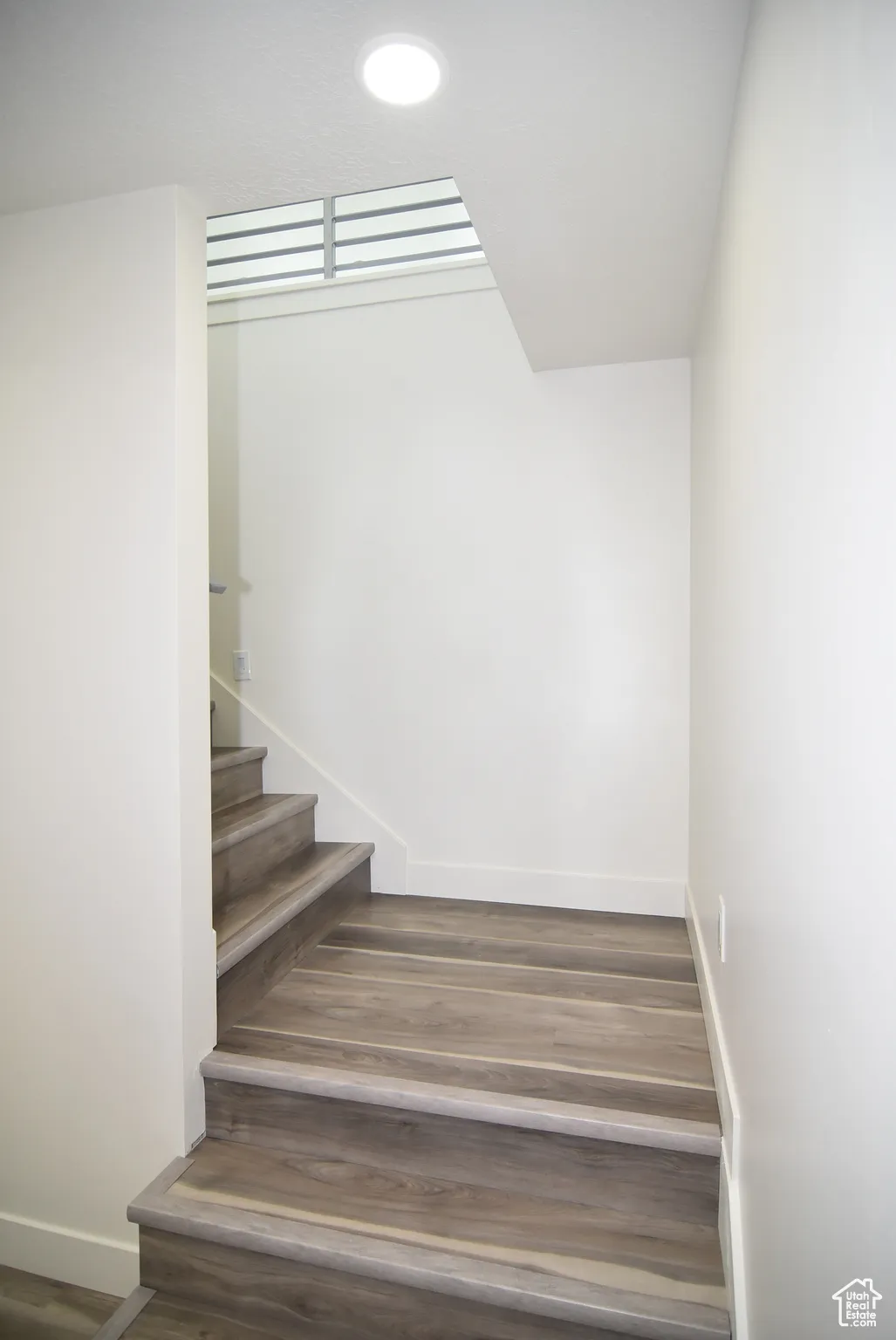 Stairs coming down to lower level