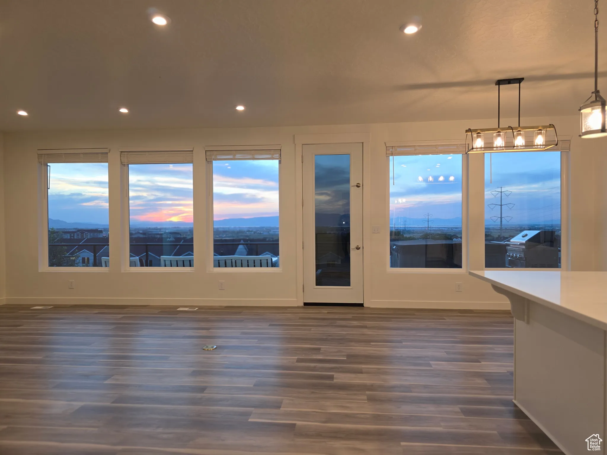Empty room featuring recessed lighting and dark wood finished floors
